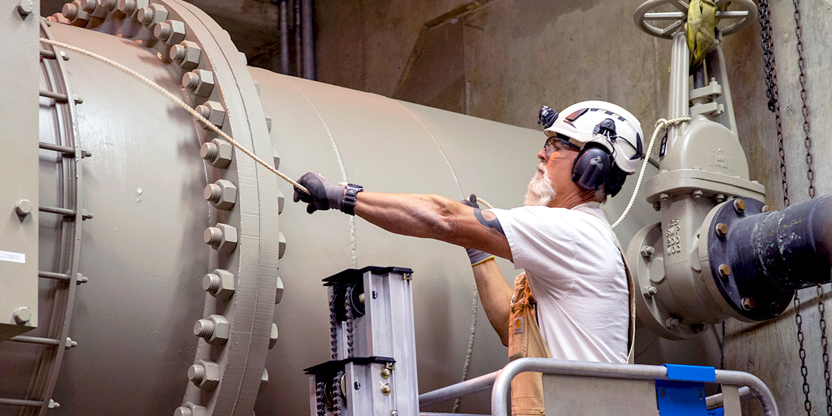 CAP employee working on pumping plant