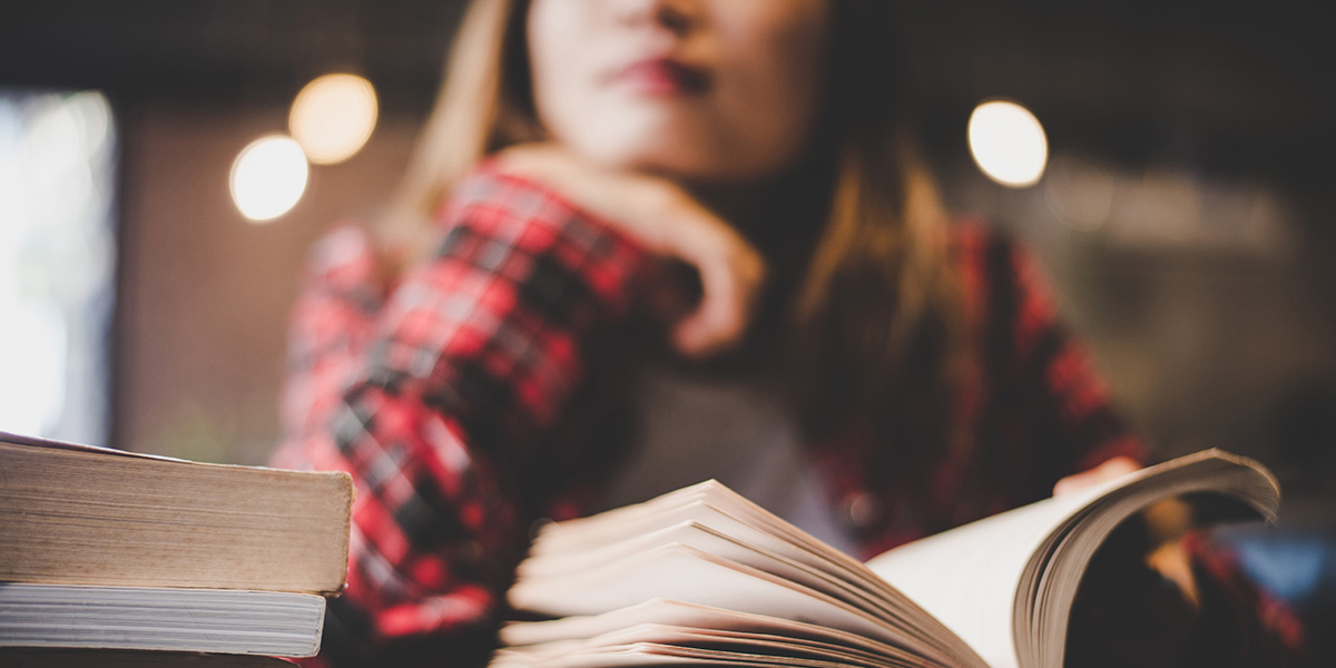 Student studying with books