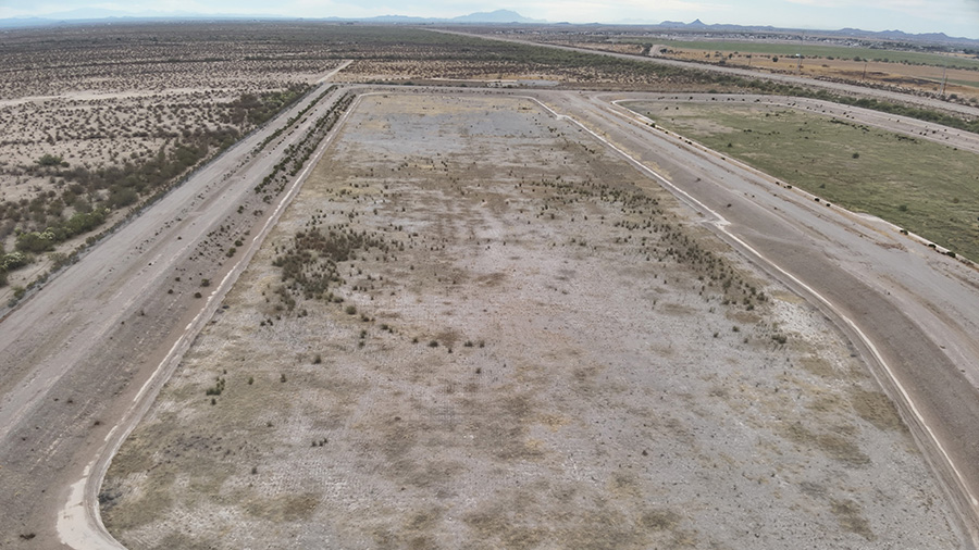 Aerial view of bare field after conducted weed removal