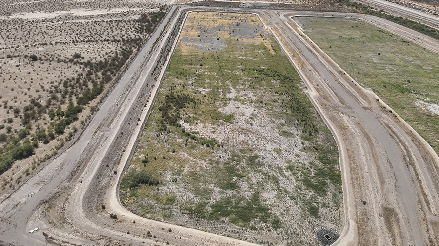 Aerial view of field with green areas of vegetation