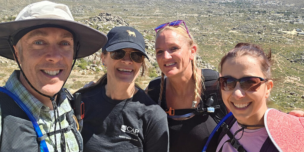 Four people enjoying a hike