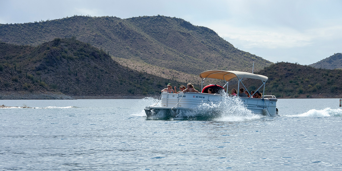 Boaters in pontoon boat on Lake Pleasant
