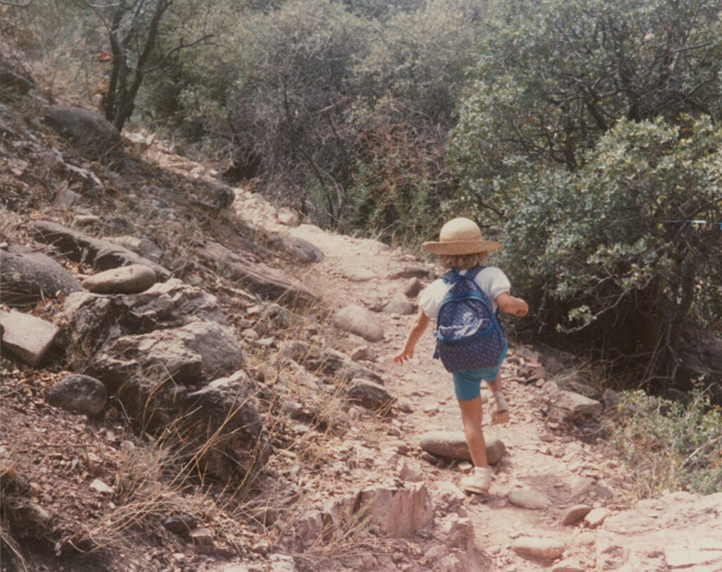 Natalie Mast childhood photo running down a hiking path