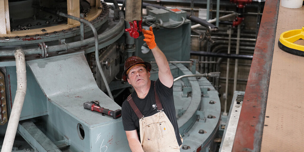 Mechanic working on pump.