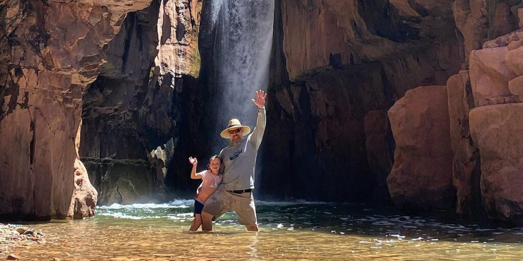 Dan Pauly in front of a waterfall