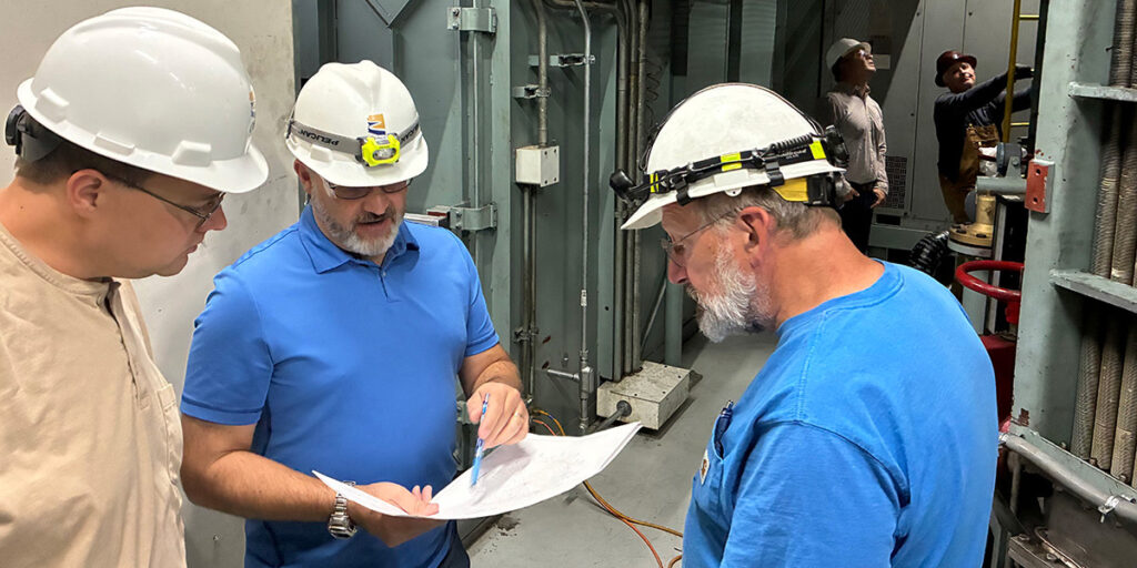 CAP Employee Phil Rettinger working with another CAP employee