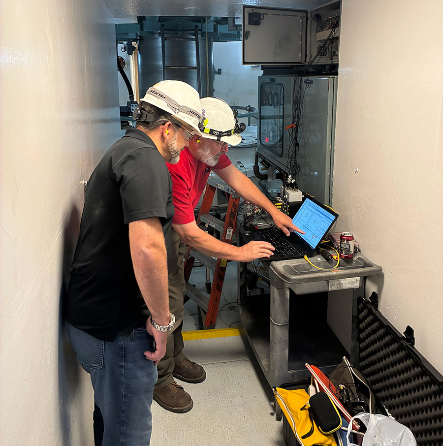 CAP employees working together on a computer