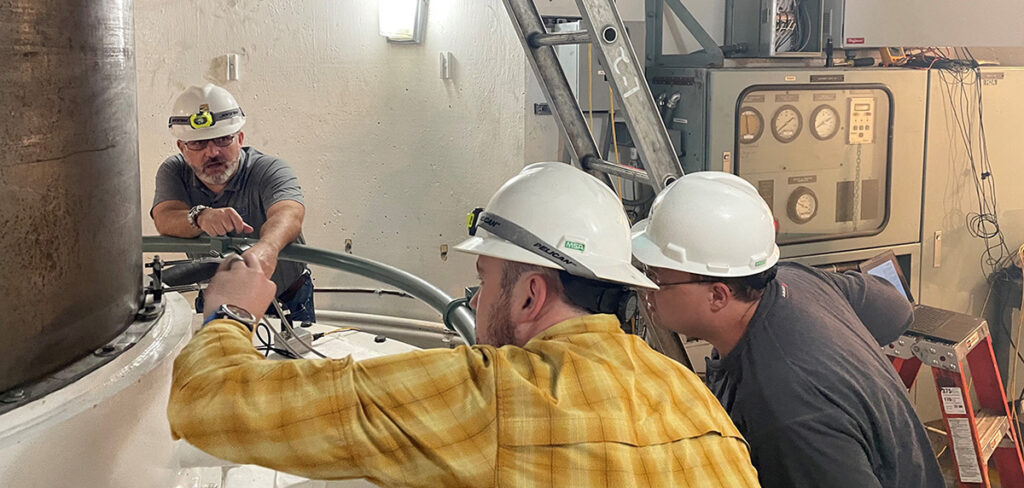 Three CAP employees working together