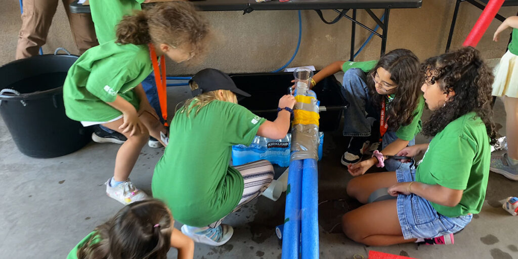 Kids work to fix a leak at the Kids Day 2026 “Discover Engineering” activity
