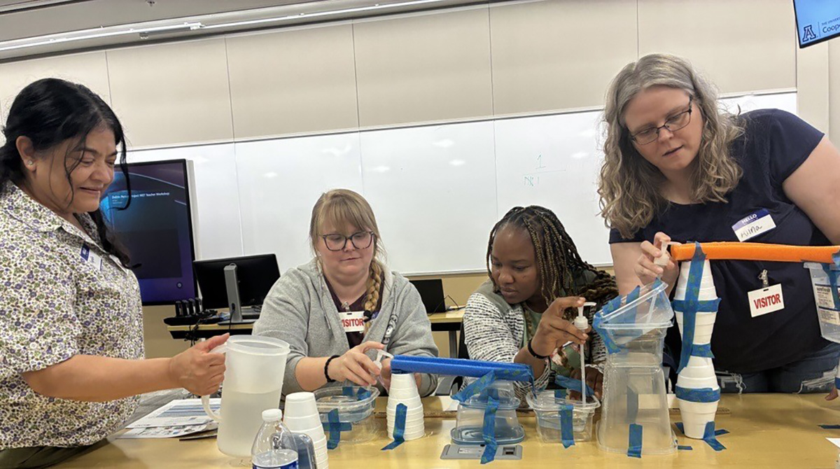 Teachers and students use pool noodles, duct tape, Styrofoam cups and plastic containers to engineer a water delivery system